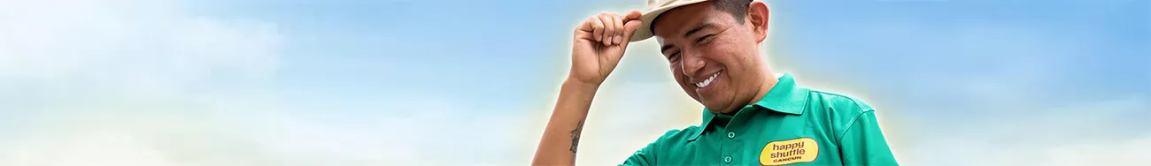 Hand Holding Denominations of Mexican Pesos